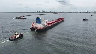 Tugboats escorting bulkvessel thru canal [upl. by Idnal12]