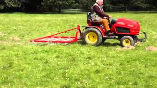 SCH 60quot Four Row Scarifying Rake on 3 Point Linkage on grass [upl. by Aneehsak984]