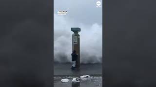 Huge California wave topples people near pier [upl. by Sitra]