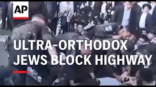 UltraOrthodox Jews block highway over Israeli Supreme Court decision on military service [upl. by Novanod]