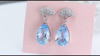 Sky Blue Topaz amp White Zircon Dangle Earrings In Rhodium over Sterling Silver 1475ctw [upl. by Arikal]