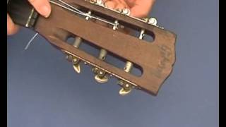 Changing strings on a Nylon String Guitar at the headstock  from guitarforbeginnerscom [upl. by Dorlisa484]