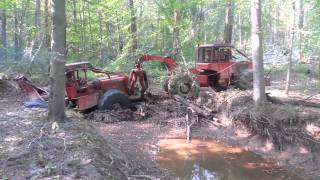 Timberjack log skidder stuck in the creek [upl. by Leirud]