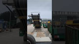 Loading a McCloskey J40 Stone Crushing Machine automobile construction operator trailer truck [upl. by Reffineg]