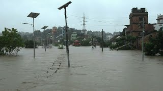 Torrential rain triggers deadly flooding in Nepal  AFP [upl. by Atnwahs]