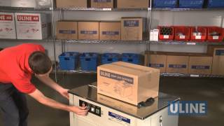 Uline H2079 SemiAutomatic Poly Strapping Machine  Demonstration [upl. by Rehpotsrihc437]