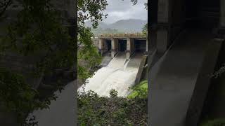 A large dam with water flowing down it [upl. by Chaves633]