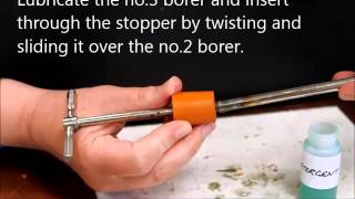 Inserting tubing through a stopper [upl. by Anileda]