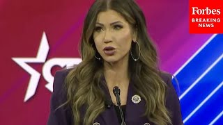 Kristi Noem Accuses Biden Of Destroying America And Taking Away Your Freedoms In CPAC Speech [upl. by Ioved801]