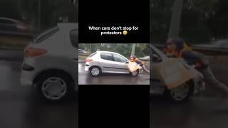 These cars did NOT want to stop 😂 funny shorts shortsfeed protest funnyshorts fails cars [upl. by Ayana457]